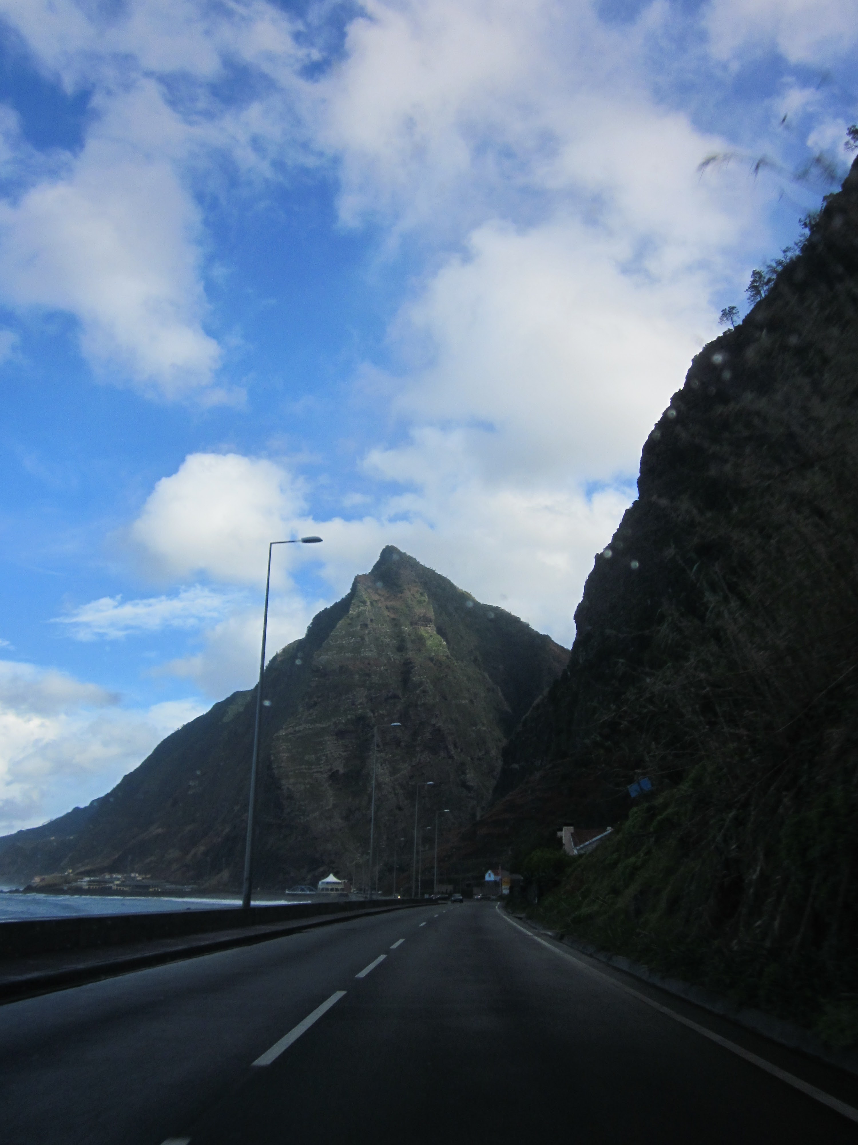 Challenging coastal mountain road in Madeira showing why SUVs are recommended for safety